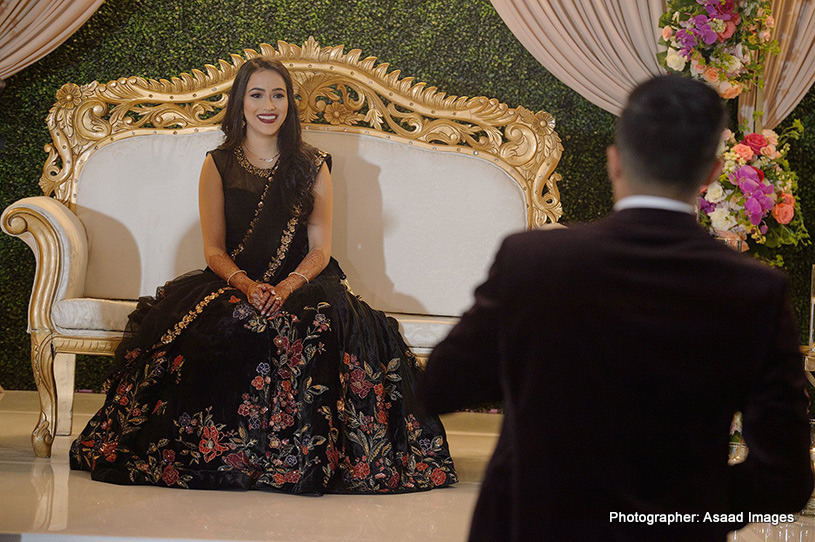 Adorable indian bride blushing at the event