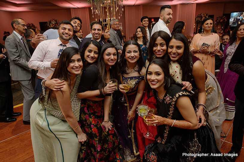 Bride taking pictures with friends