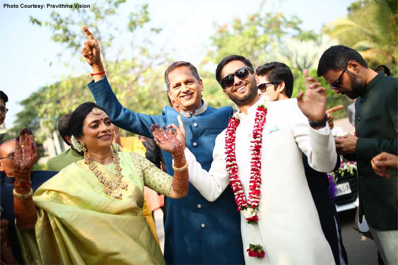 Indian Groom and parents Dancing at the Baraat