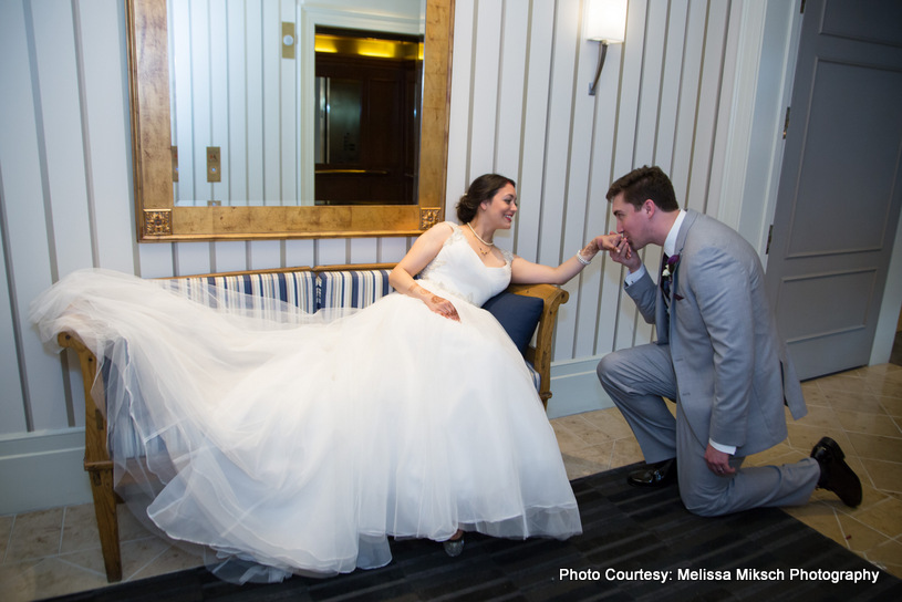 Groom kissing to Bride's hand