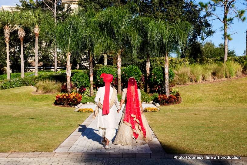 Indian Couple walking to the ceremony 