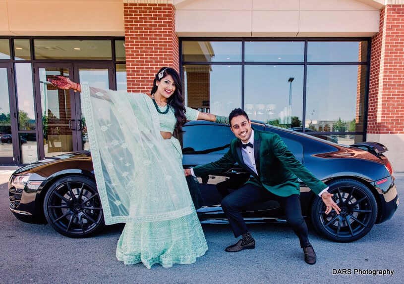 Indian bride and Groom posing Infront of Supercar