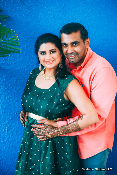 Indian Couple posing after Mehndi Ceremony