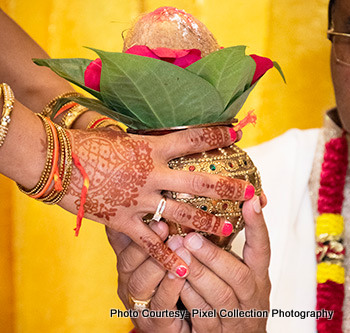 Holding Jar and coconut in Hand