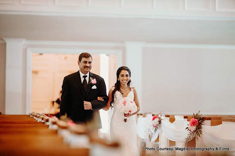 Bride entering wedding venue with her father