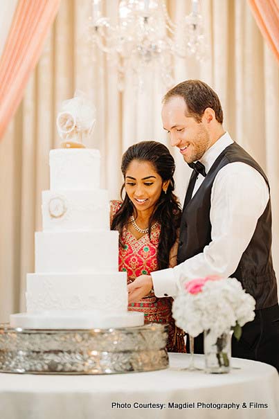 Couple cutting Wedding Cake