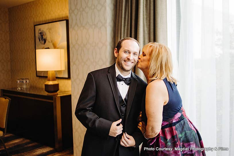 Groom posing with his family member