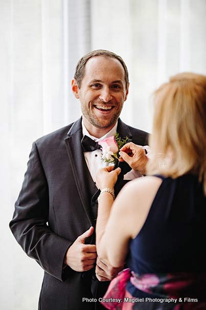 Mother helping groom ready for his big day