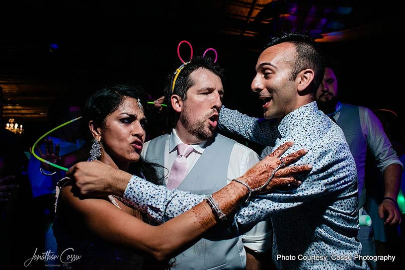 Gorgeous Indian Couple dancing with friends