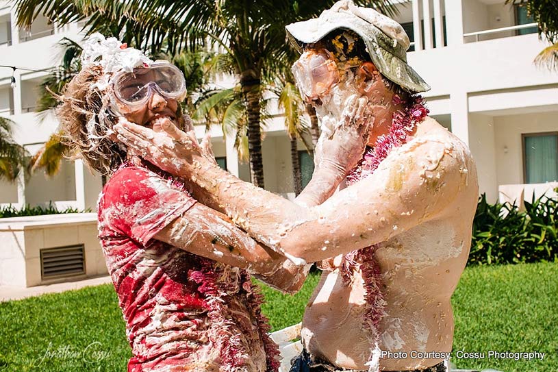 Couple applying cake to each-other