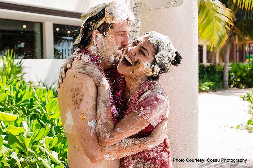 Groom kissing bride to be