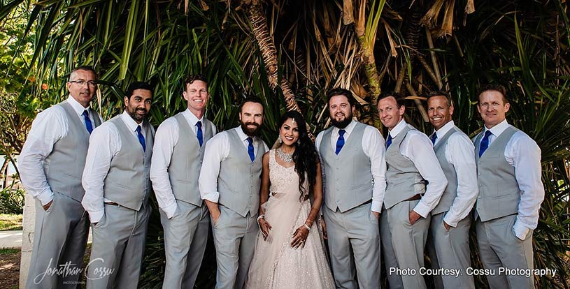 Indian Bride posing with Groomsmen