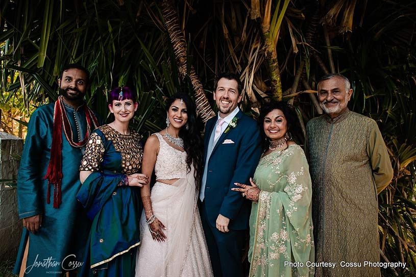 Couple posing with family