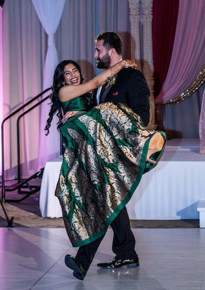 Couple having fun at wedding reception