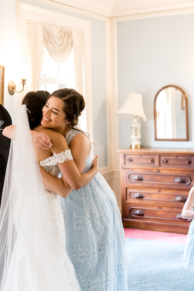 Indian Bride giving hug to her friend