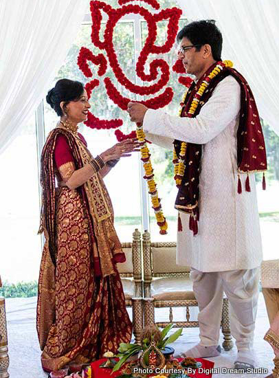 Parents of Indian bride performing Indian wedding ritual for kanyadan