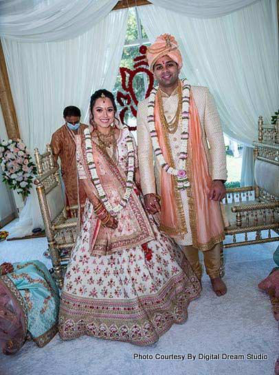 Indian couple possing after garland ceremony