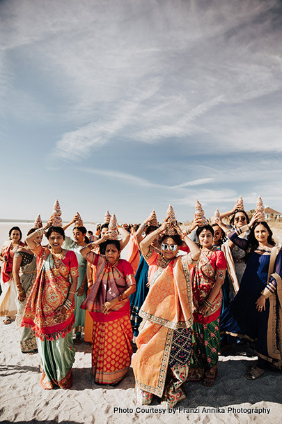 Indian weddding guest performing wedding ritual