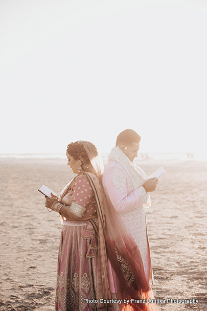 Indian bride and groom being emotional by reading love notes