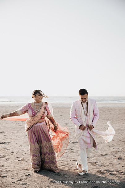 Indian Bride and Groom Walking on sea shore
