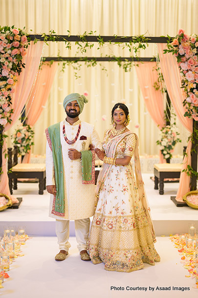 Indian bride and groom under wedding Mandap