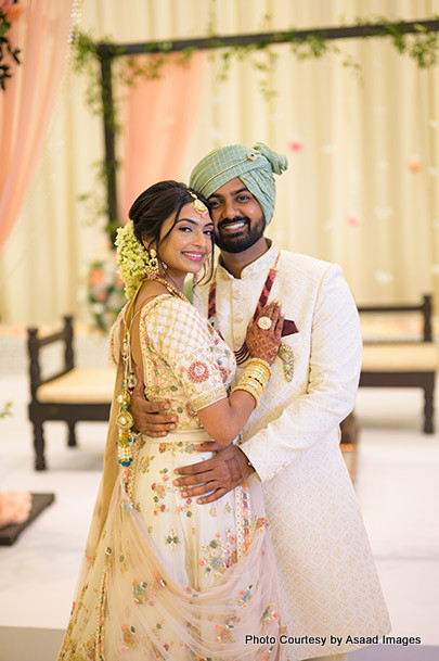 Indian bride and groom hugging to each other