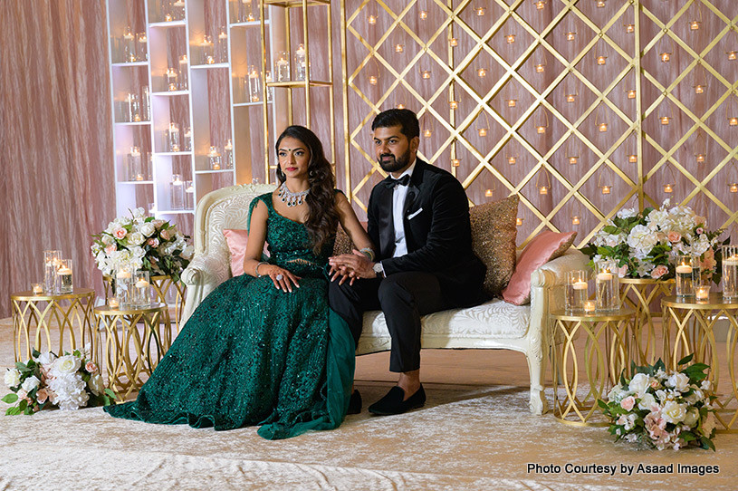 Indian wedding couple holding each others hands