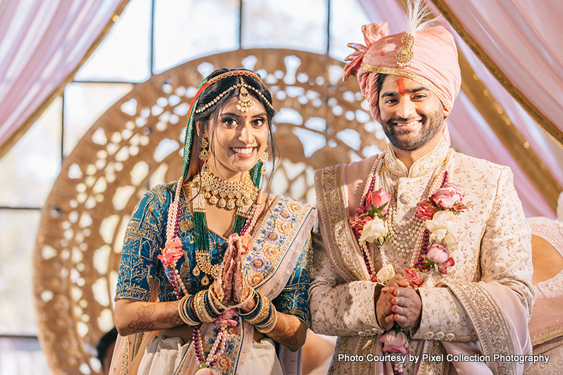 Indian bride and groom getting Blessings from guest