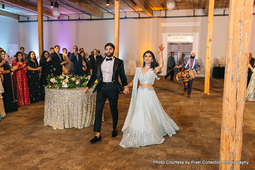 Grand Entrance of Indian bride and groom with dhol player