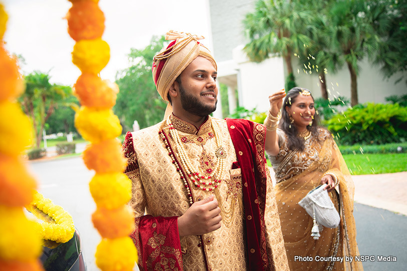 Groom enjoying flower shower