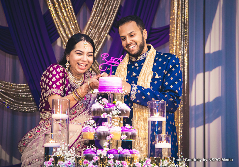 Bride and Groom Slicing the cake together