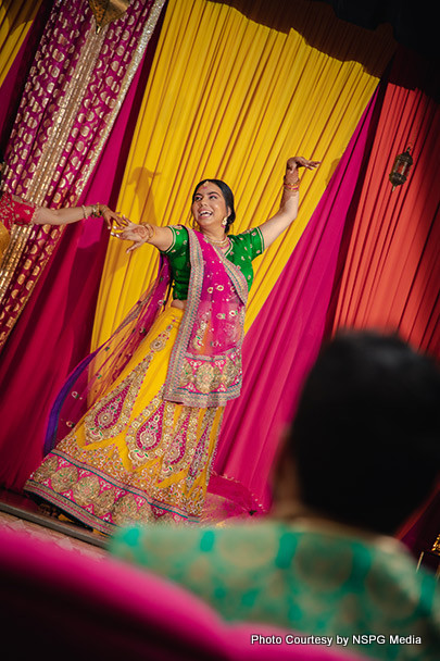 Indian bride giving dance performance with their friends