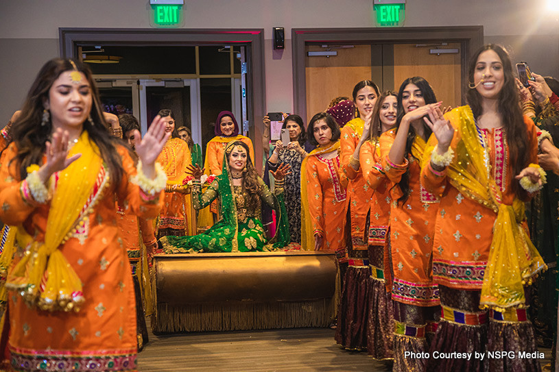 Indian bride giving dance performance with their friends
