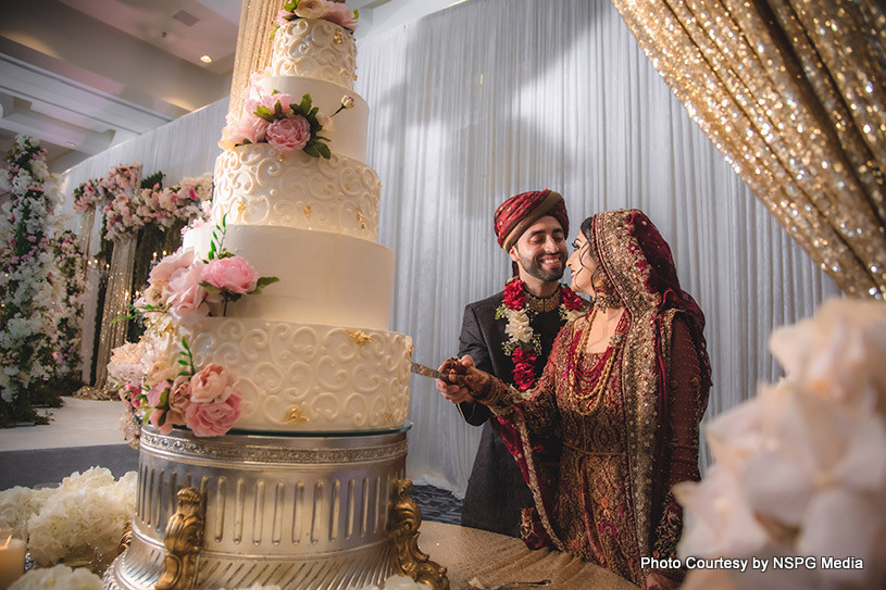 Bride and Groom Slicing the cake together