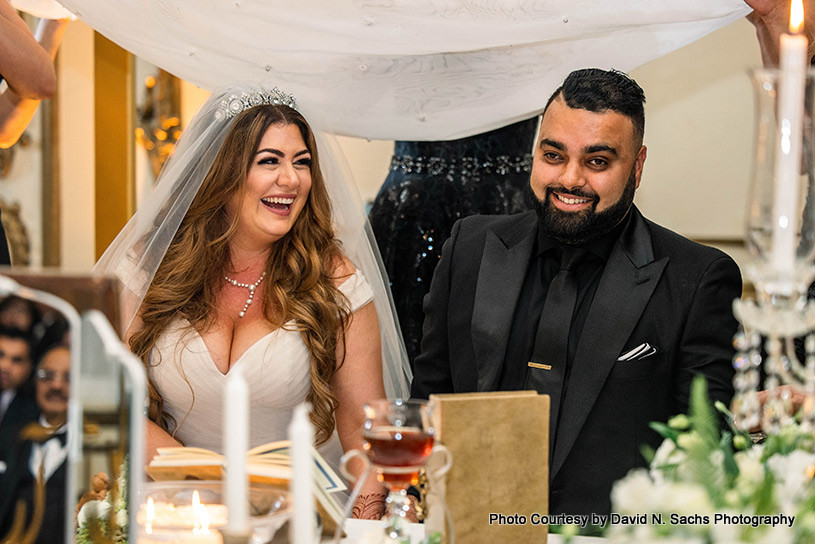  Indian bride and groom performing persian wedding rituals