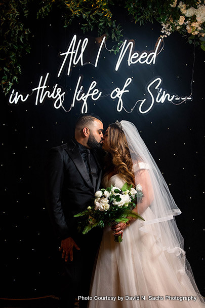 Indian bride and groom kissing to each other