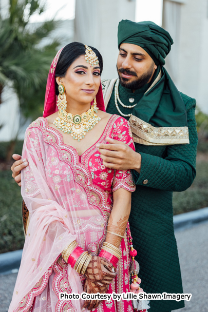 Indian wedding couple possing for outdoor photoshoot