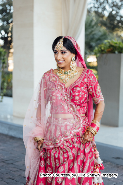 Beautiful Indian Bride happily posing for photoshoot