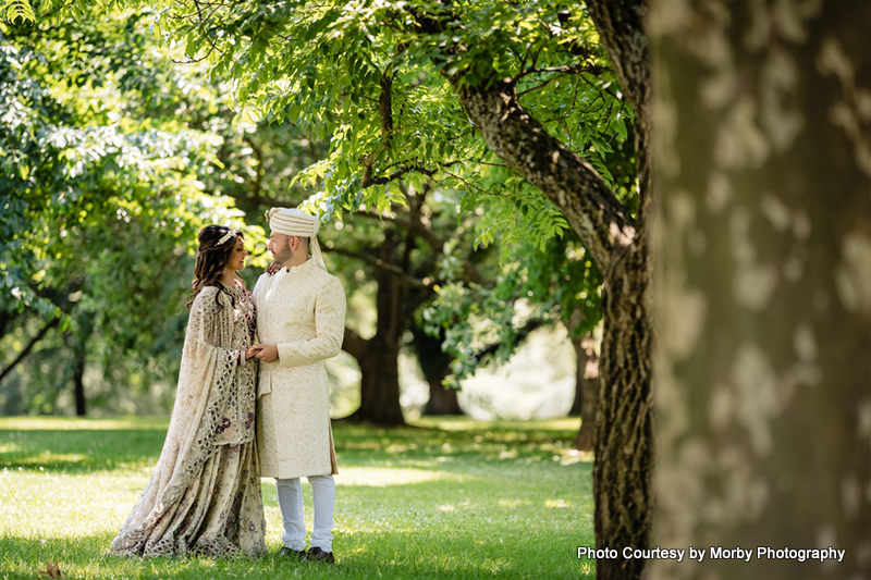 Indian wedding couple possing for outdoor photoshoot