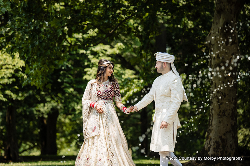 Indian wedding couple possing for outdoor photoshoot