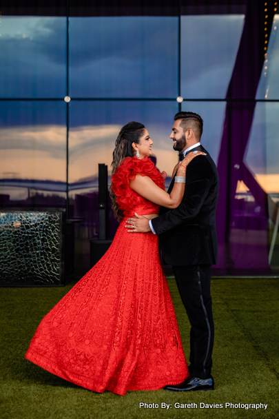 Red gown and black suit what a great combination