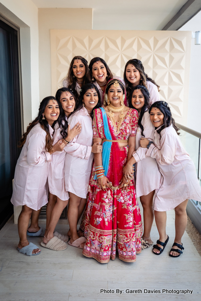 Indian bride with bridesmaid capture