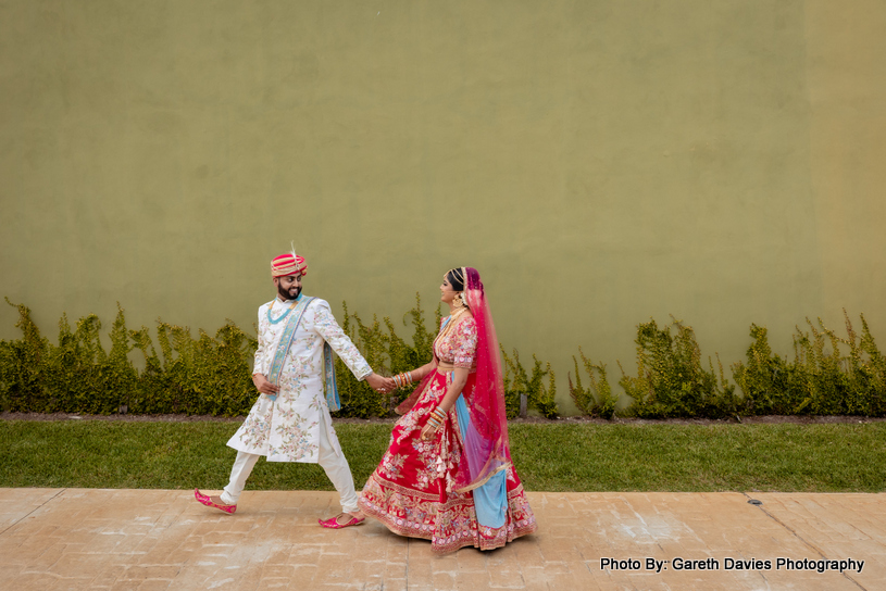 indian adult couple holding walking on the road with holding hand together 