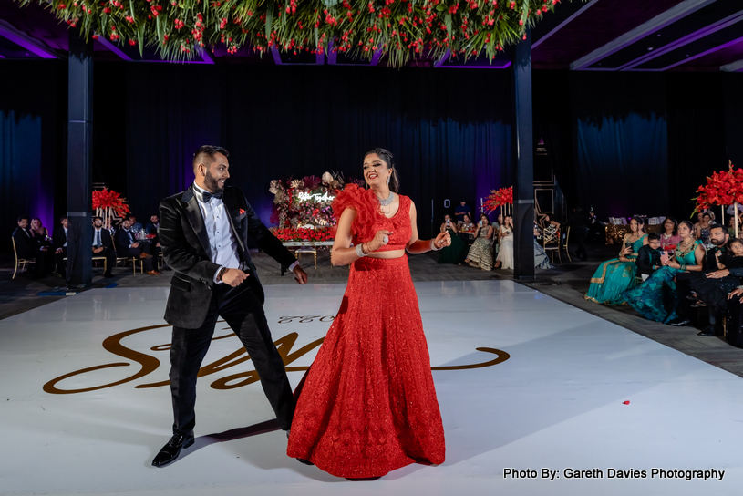 Indian newly weds couple dancing on dance floor 