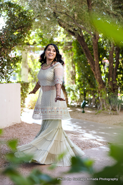 New Indian bride twirling in her stunning wedding attire, capturing the joy of celebration