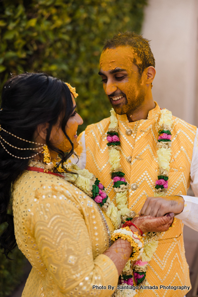 Indian groom showing his love to bride capture