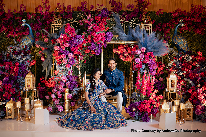 indian wedding couple at beautifully decorated stage