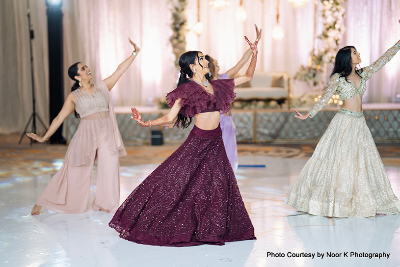 Indian bride giving dance performance with their friends