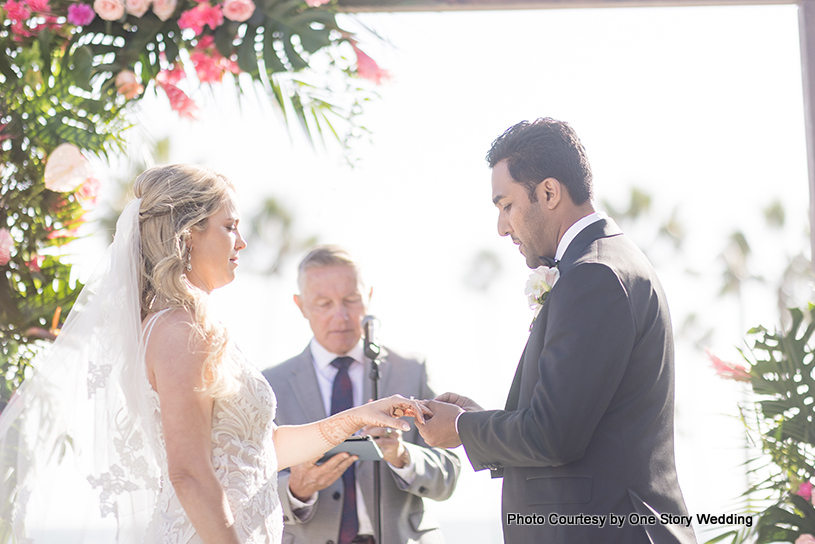 Indian wedding couple exchange the rings