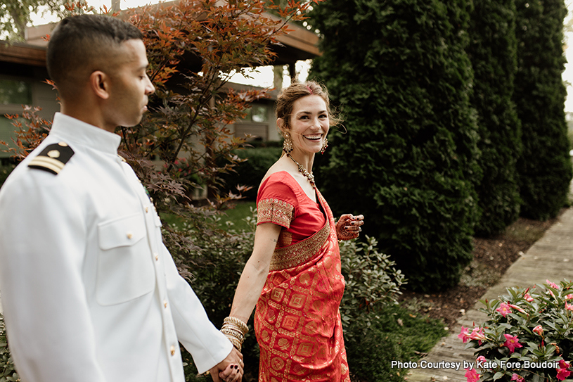 Indian wedding couple holding each other's hand